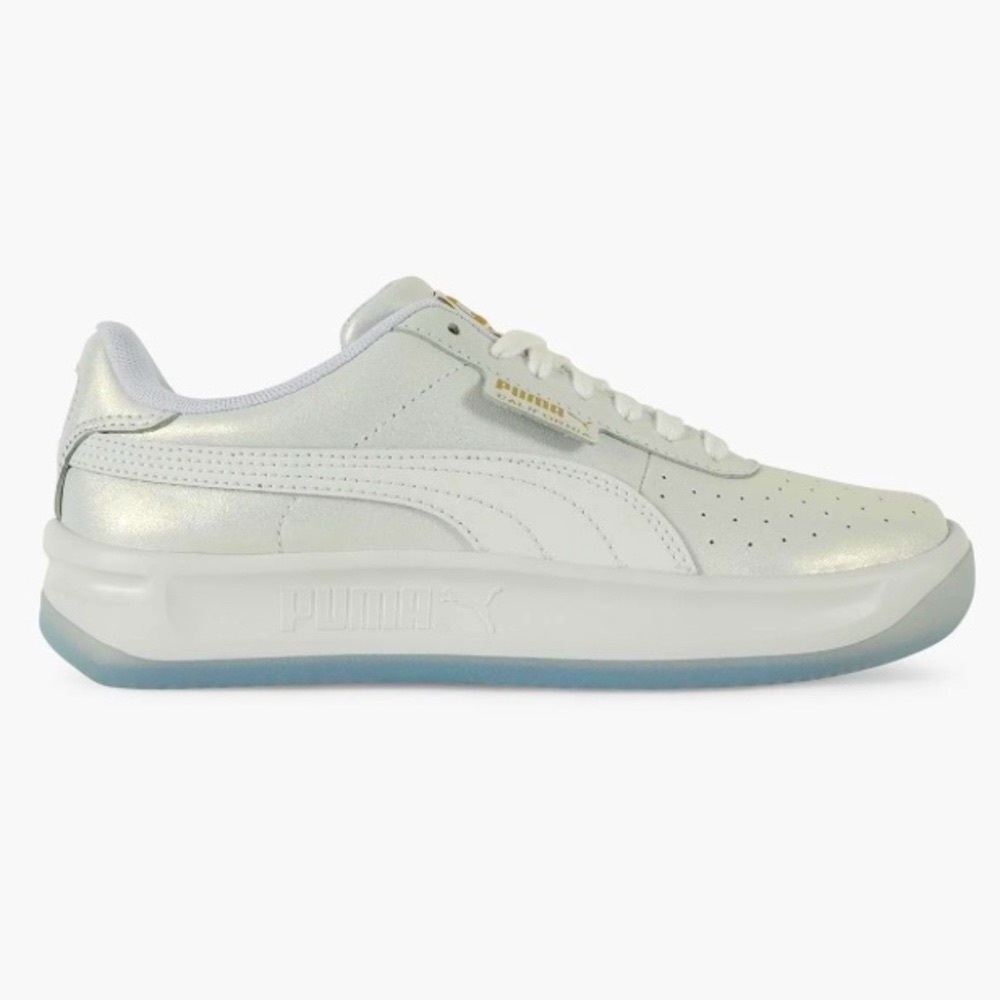 Puma white shimmery sneakers.